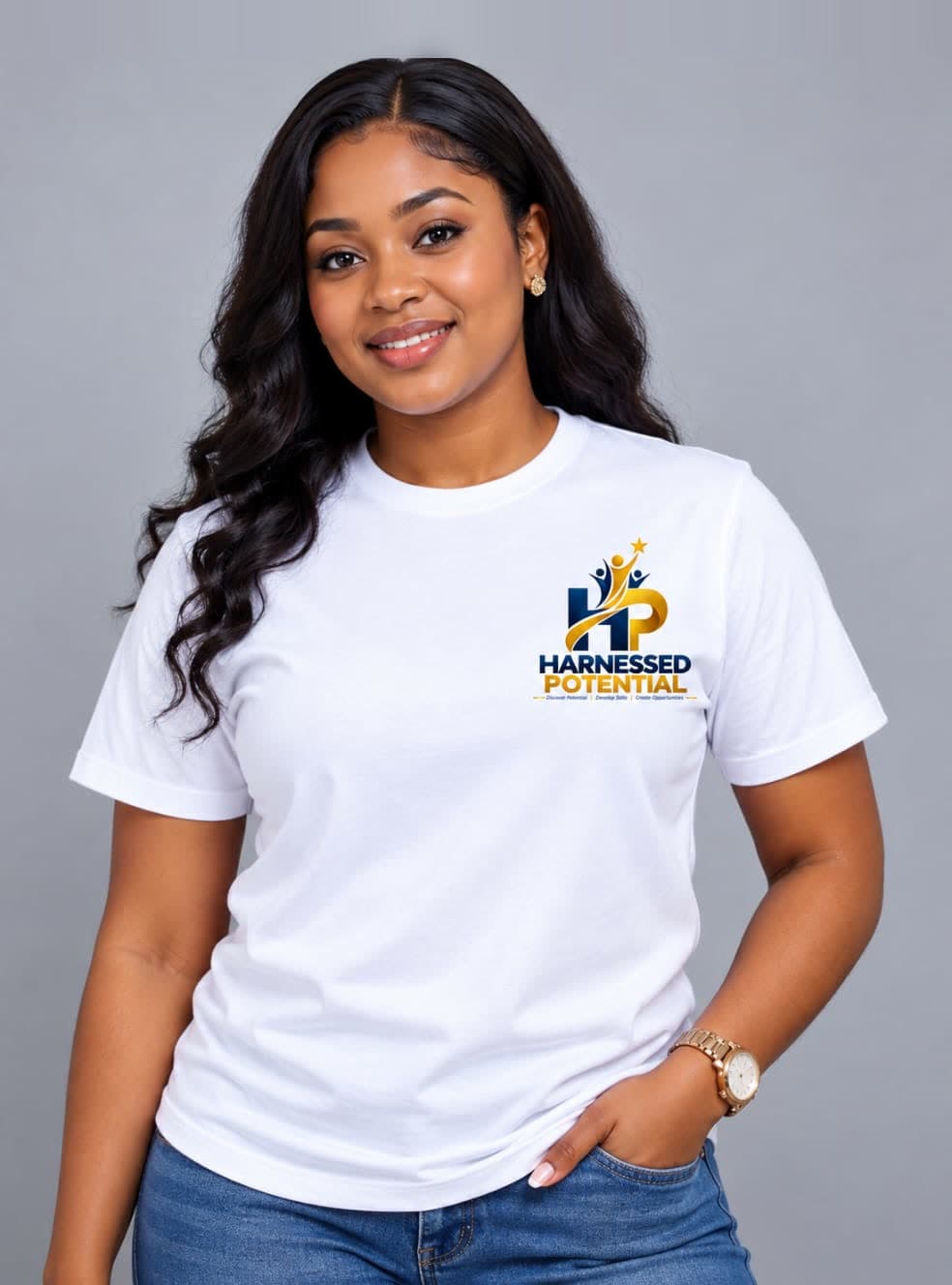 A smiling young woman wearing a white Harnessed Potential t-shirt